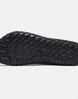 Dannto black barefoot trail shoes shown from the bottom