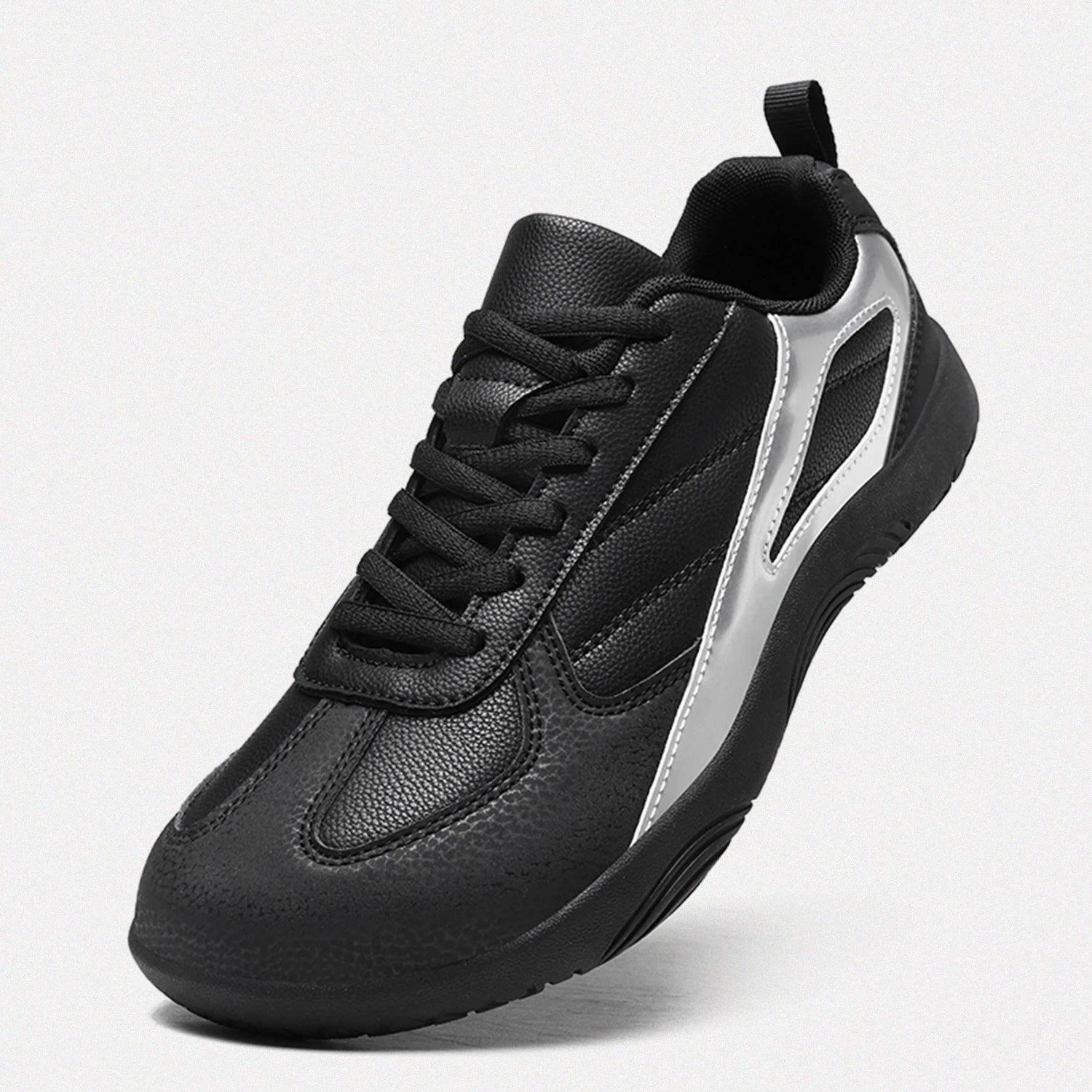 Dannto black casual barefoot shoes shown from a three quarter view