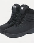 two Dannto women‘s black winter snow Boots shown at a side angle
