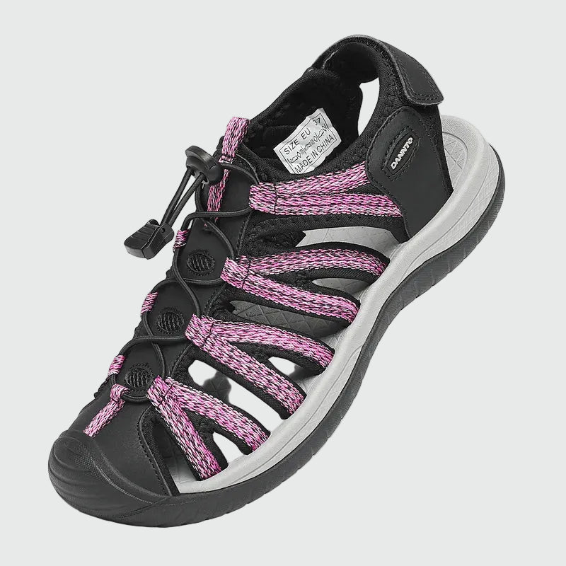 Dannto women's closed toe hiking sandals S2 black pink shown from a three quarter view